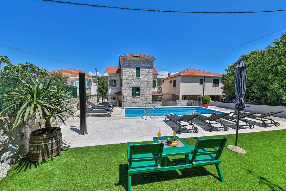 Garden lounge with green shutters