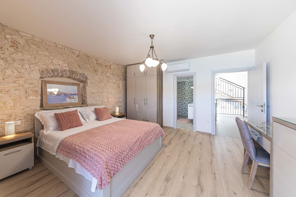 Bedroom in limestone and blush tones